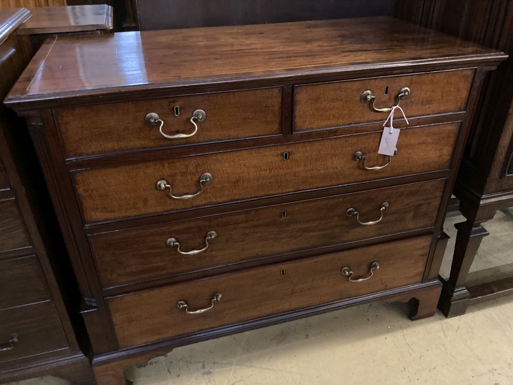 A George III satinwood strung mahogany chest with fluted column canted angles, width 104cm, depth 50cm, height 84cm